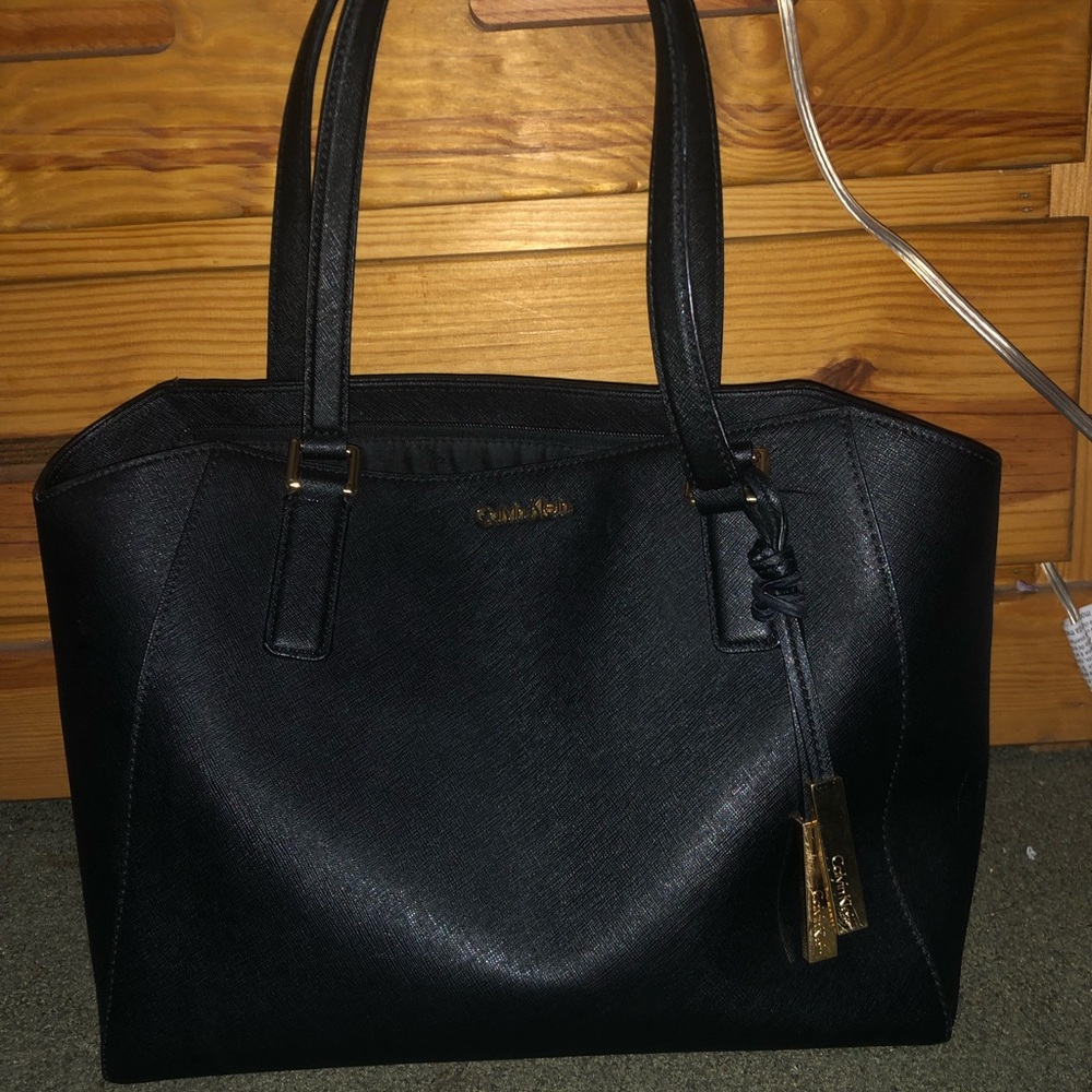 Black Calvin Klein tote with gold metal